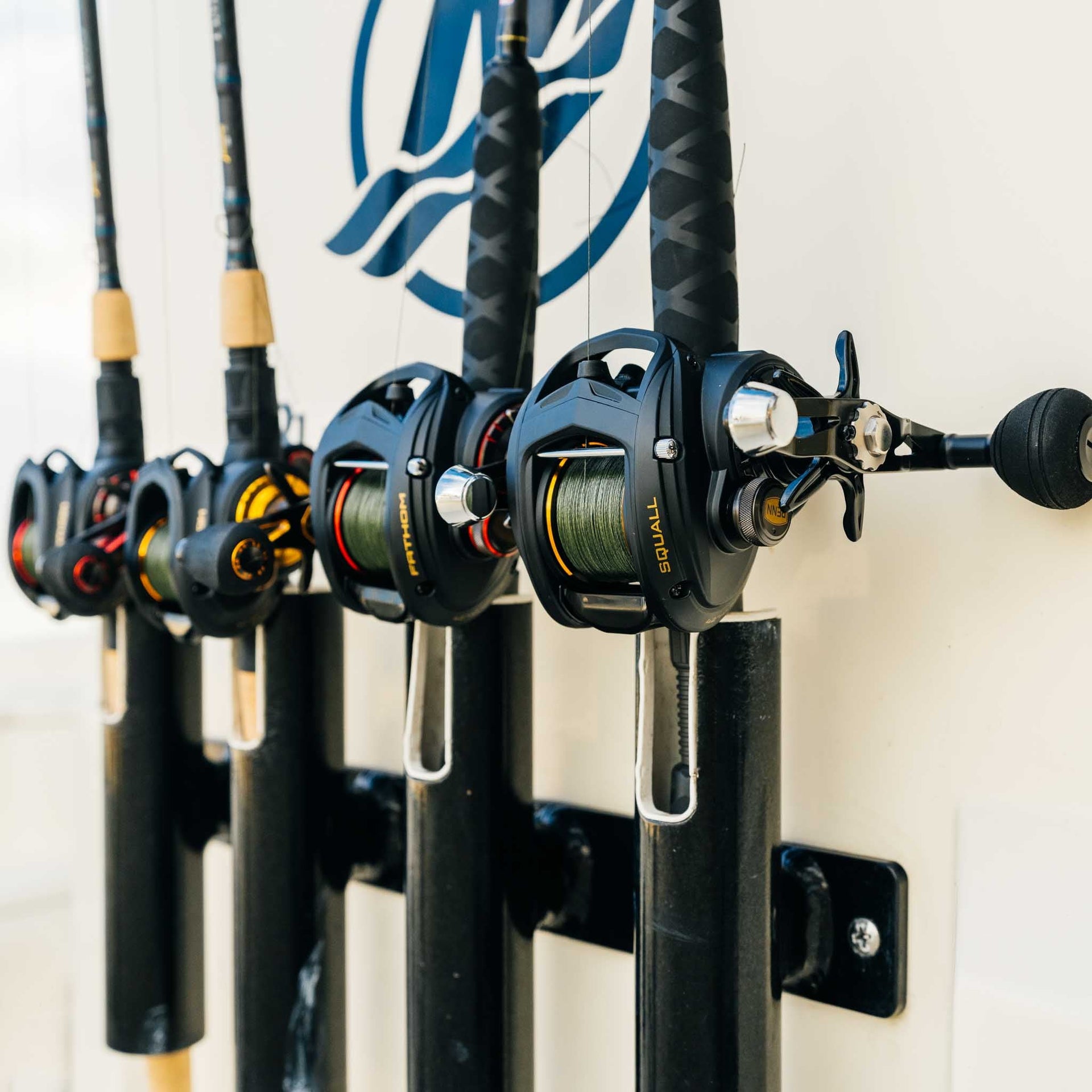 4 Penn rods and reels side by side